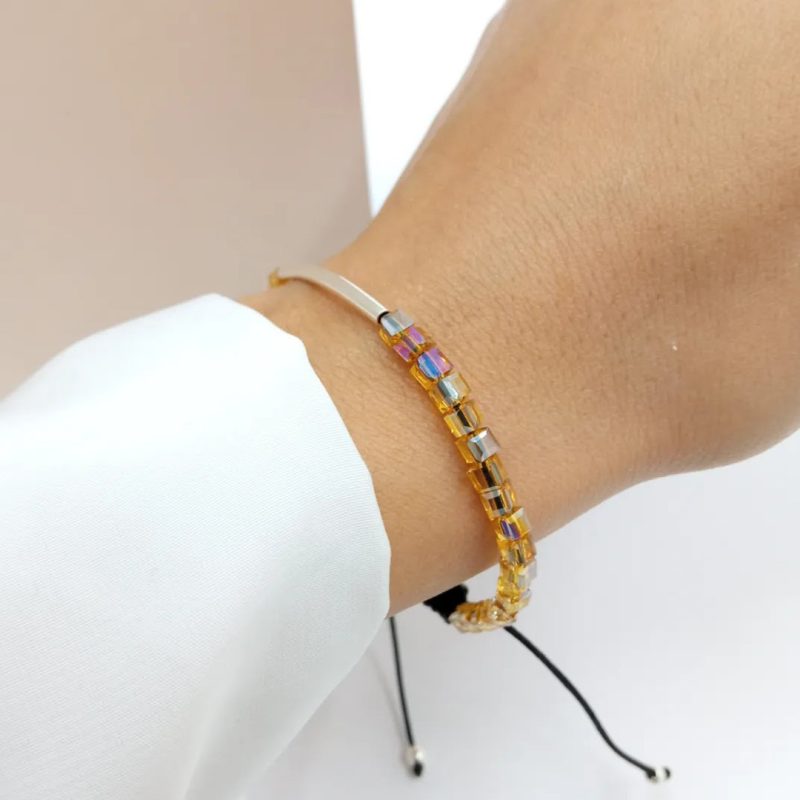 Pulsera regulable hilo negro con cristales ambar y tubo curvo plata